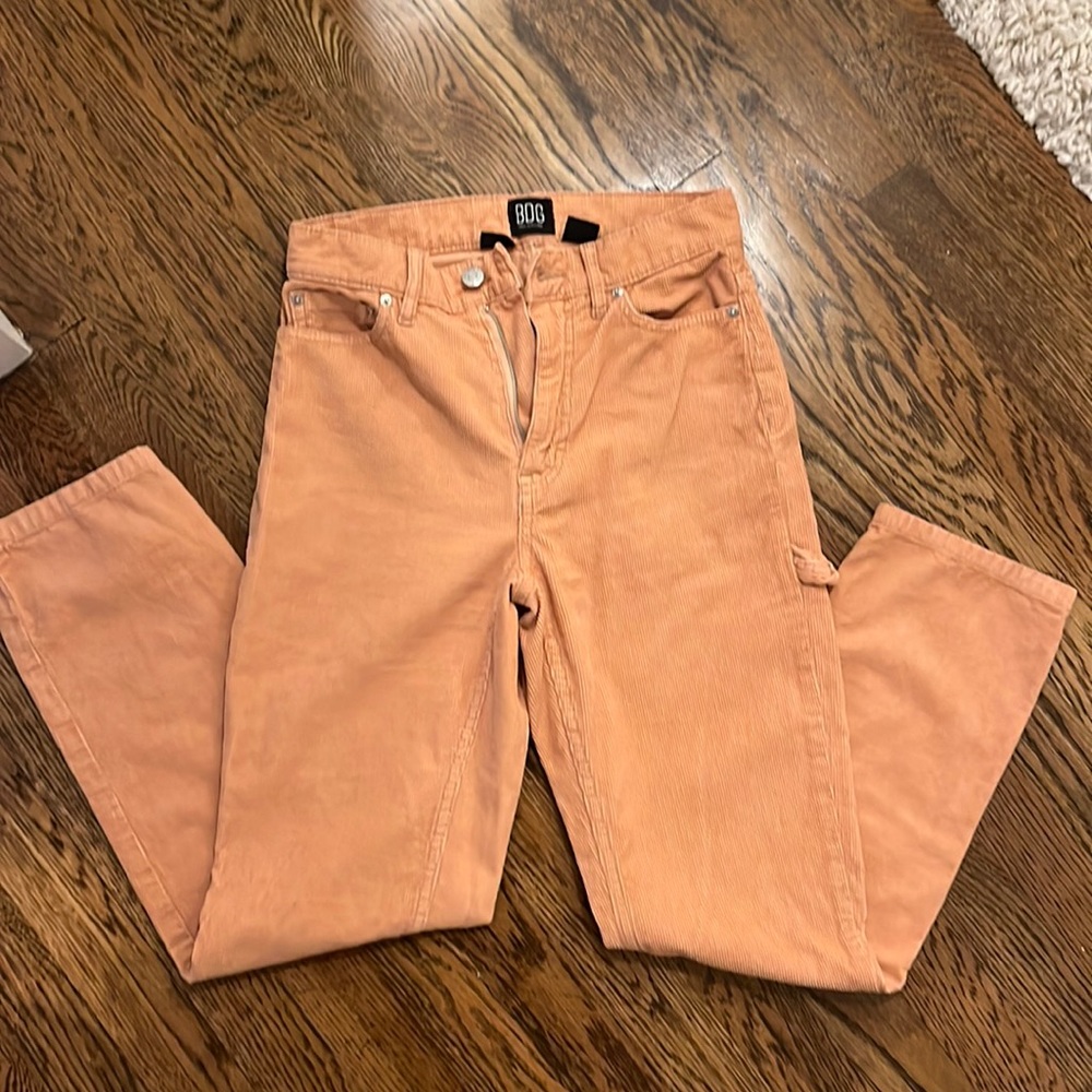 Pair of rusty orange corduroy jeans from BDG. They are size 24.